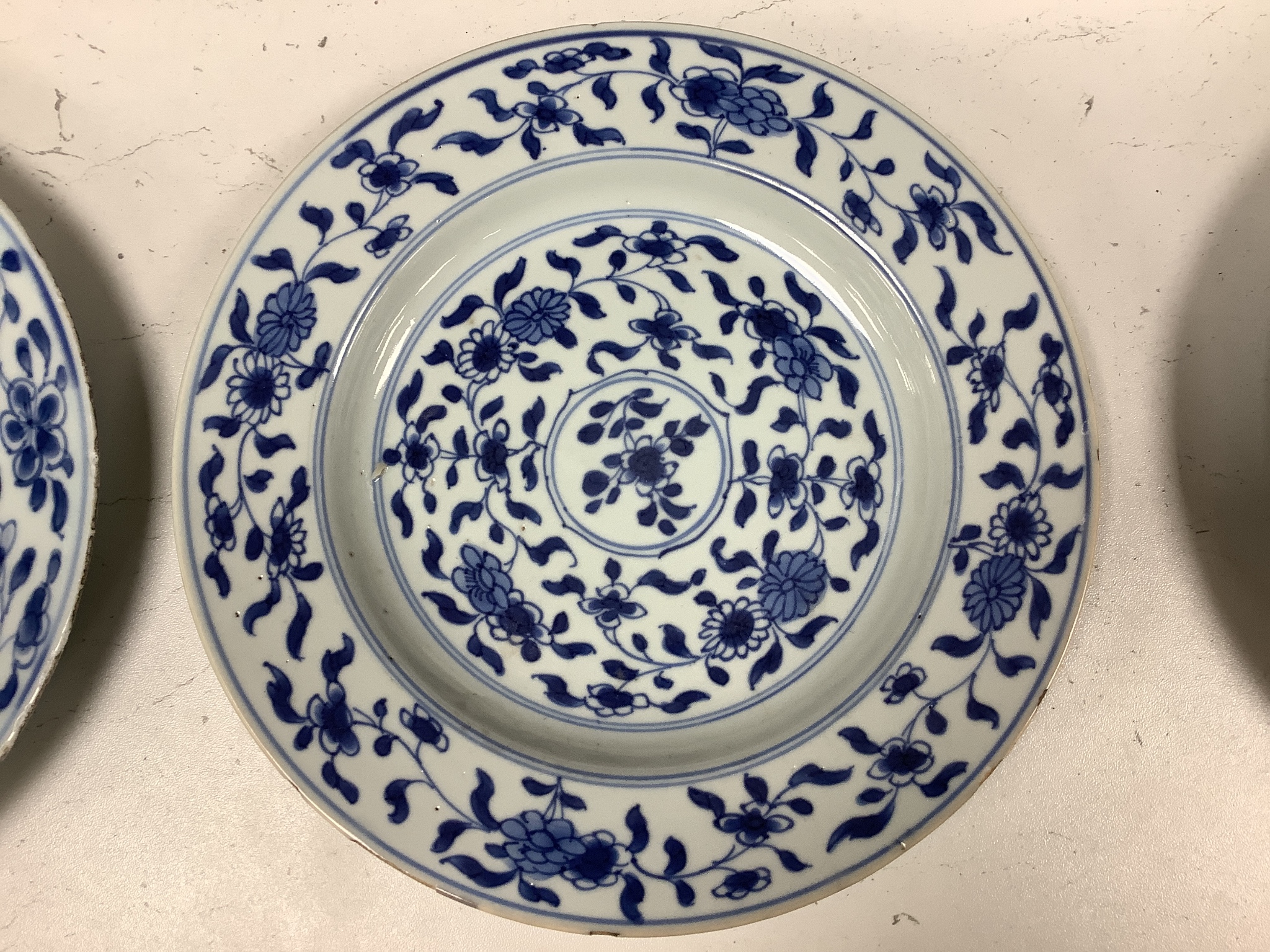 A pair of 18th century Chinese blue and white plates, together with two Chinese Imari dishes, all Kangxi period, largest 23cm